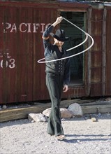A lasso artist performing