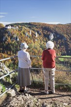 Two elderly ladies looking at the view over Danube Gorge from Burg Wildenstein Castle