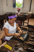 Women rolling cigars in the Dannemann cigar company