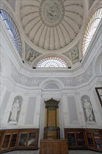 Lecture hall with statues of scientists