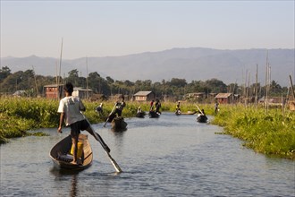 One-legged rowers in canoes