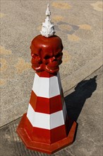 Traffic cone with a skull at Wat Rong Khun