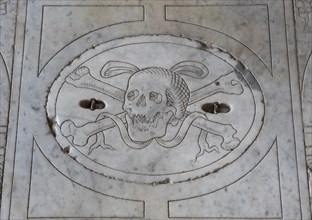 Marble slab with a skull relief