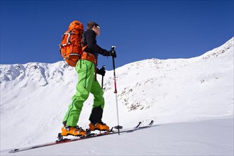Cross-country skier ascending Schongrubspitze Mountain