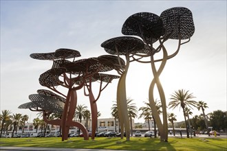 Large pine tree sculpture on the promenade of La Pineda