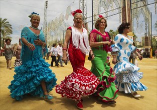 Women wearing gypsy dresses at the Feria del Caballo