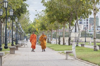 Buddhist monks walking in central Phnom Penh