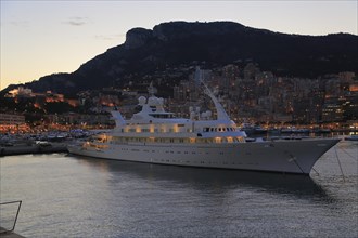Motor yacht Atlantis II in the evening in Port Hercule