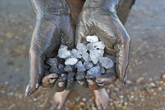 Woman's hands holding salt crystals