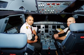 Pilots in the cockpit of an Airbus A-320