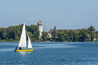 Sailboat in front of the bell tower of Frauenworth Abbey