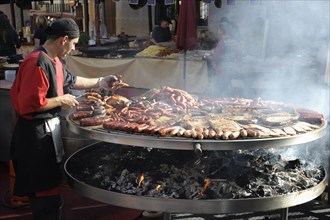 Cook handles giant barbecue at the annual All Saints Market in Cocentaina