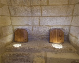 Simple medieval toilet in the Castillo de Belmonte castle