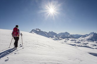 Ski tourer climbing Seekofel mountain