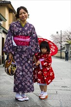 Traditionally dressed mother and daughter