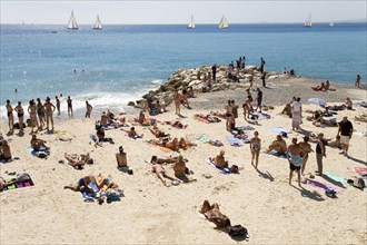 Tourists on the beach on Promenade des Anglais