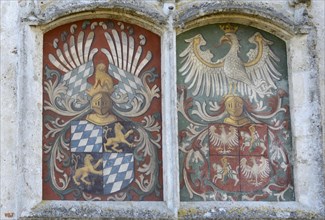 Alliance coat of arms on the castle wall