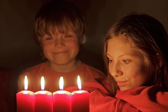 Children looking at Advent candles