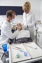 Senior man receiving treatment at the dentist