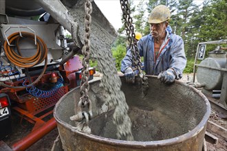 Worker preparing the pile foundation for the concrete piles for the power masts of a 380 kV high-voltage line