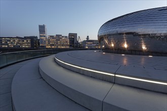 Skyline and futuristic pavilion with a mirrored facade