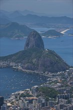 Outlook from the Christ the Redeemer statue over Rio de Janeiro and the Sugar Loaf