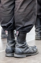 Member of a right-wing Hungarian party wearing combat boots