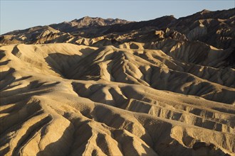 Eroded badlands in the Gower Gulch seen from Zabriskie Point in the evening light