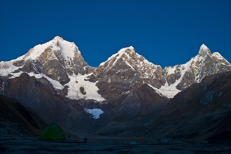 Snow capped mountains in morning light