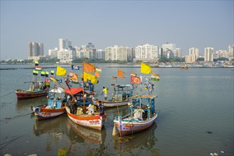 The skyline of the suburb Churchgate seen across the Back Bay with some fishing boats