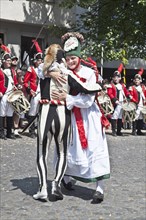 Peasant dancing with a jester