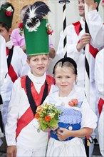 Boy and girl dressed in costume during the parade