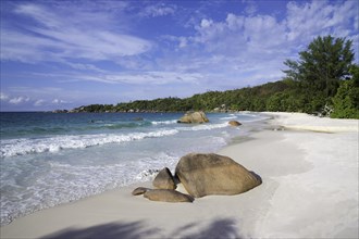 Sandy beach with the typical rock formations of the Seychelles