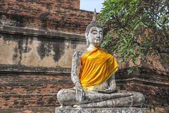 Buddha statue next to the central stupa
