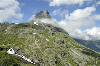 Bispen Mountain above the Trollstigen Road with the Stigfossen waterfall