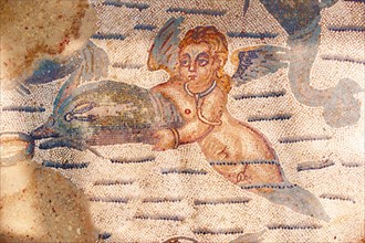 Ancient Roman mosaic of a dolphin and water nymph