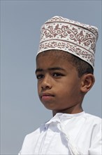 Omani boy wearing a traditional cap called a Kummah