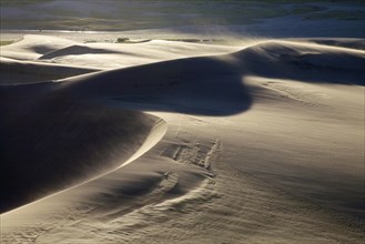 Sand blowing across the sand dunes