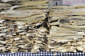Icelandic salted dried cod stacked in market stall at the annual All Saints Market in Cocentaina