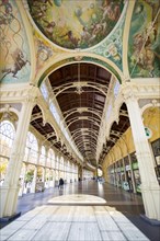 Cast-iron colonnade with ceiling paintings