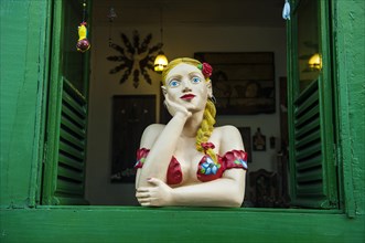 Traditional puppet in a window