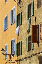 Row of houses with colourful shutters
