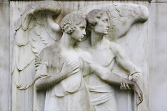 Angel and a female figure on a gravestone