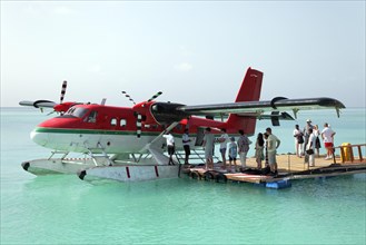 Passengers boarding a De Havilland Canada DHC-6 Twin Otter hydroplane