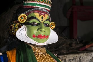 A Katakali artist with the complete make up of the character Arjun for the Santhana Gopalam play during a temple festival