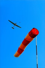 Glider at winch launching and wind sock as indicator for direction and strength of the wind