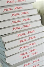 Stacked pizza boxes