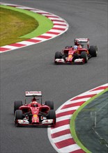 Kimi Raikkonen in the Ferrari F14 followed by Fernando Alonso in the Ferrari F14 T