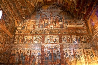 Naive Greek Catholic frescoes inside the wooden Ieud Hill Church