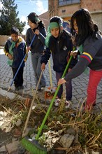 Children and young people cleaning the town on a day of action to protect the environment